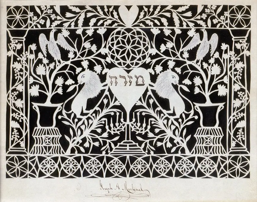 Tấm mizrah cắt giấy của Joseph A. Michael, Hoa Kỳ, khoảng năm 1870. Giữa tấm là trái tim ghi chữ Đông, hai bên có hai sư tử. Bảo tàng Do Thái, New York.