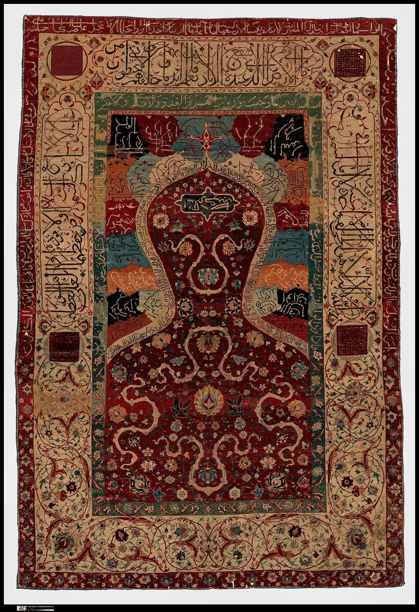 Thảm cầu nguyện, Iran, cuối thế kỷ 16. Giữa thảm là hình vòm mihrab, viền quanh là các ô chữ. Bảo tàng Metropolitan, New York.