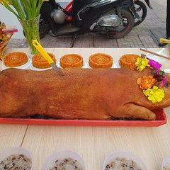 Whole Grilled Snakehead Fish, Roast Pork or Red Gac Sticky Rice
